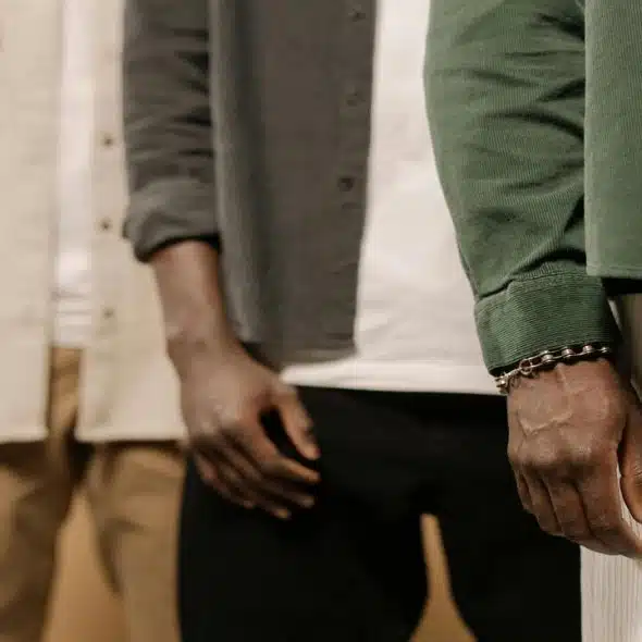 Men posing for photos in studio.