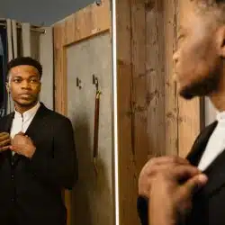 A man looking at the mirror