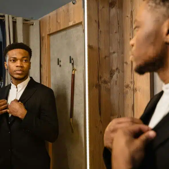 A man looking at the mirror