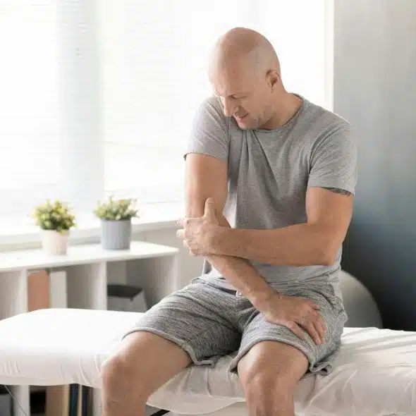 A man with hurting elbow