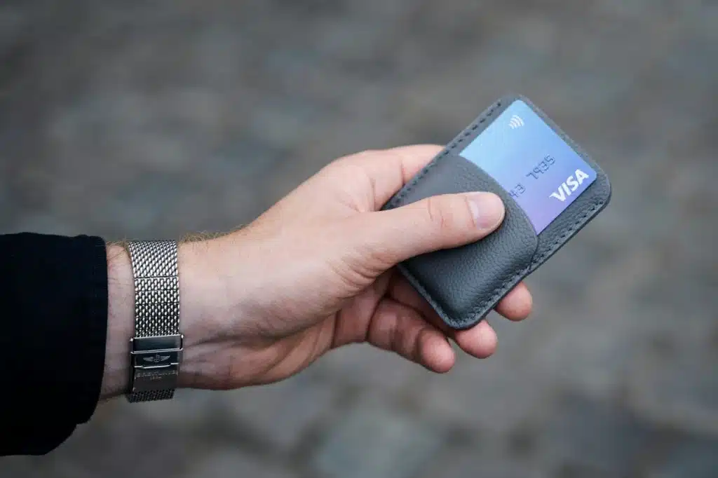 A man holding a cardholder