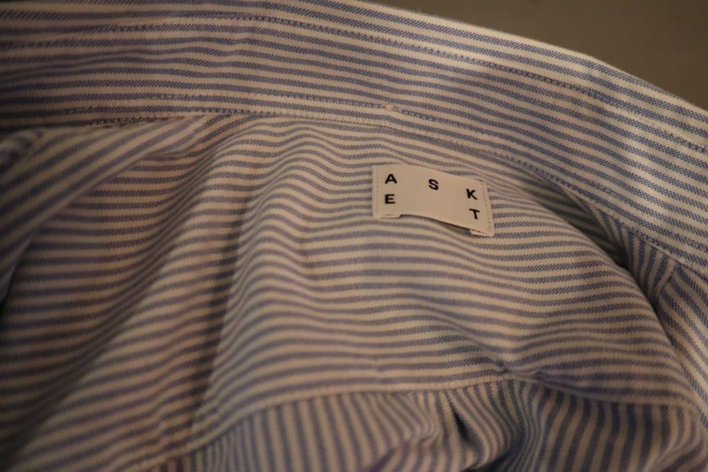Asket Brand Label on Oxford Shirt with Blue Stripes