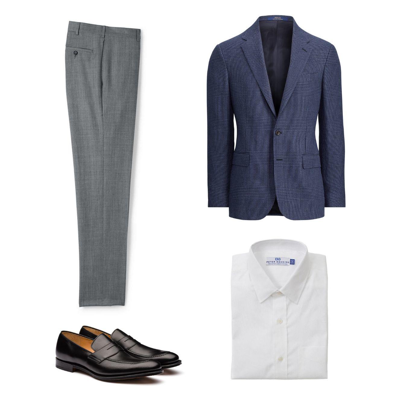 Grey men's slacks lying next to a blue blazer, white dress shirt, and loafers.