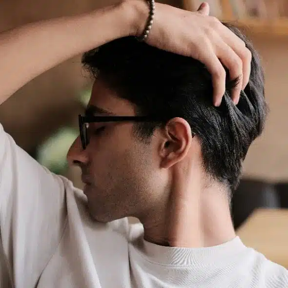 A man checking his hair