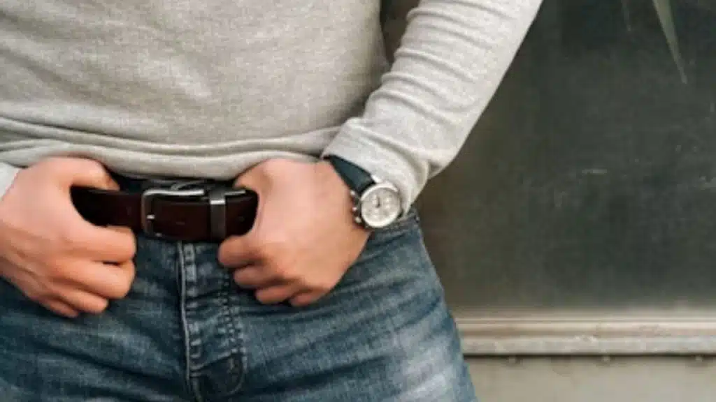 Raw edged brown leather belt paired with rugged jeans