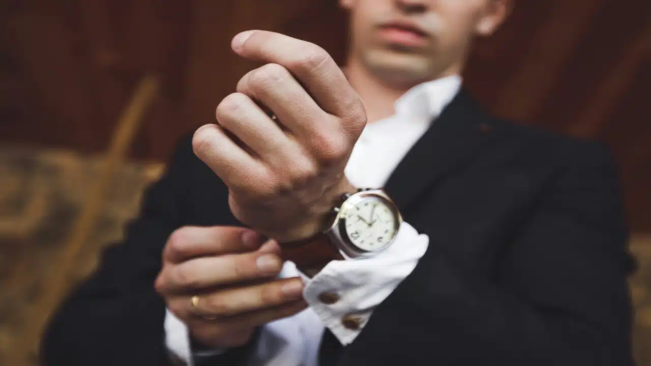 A man wearing a leather watch.