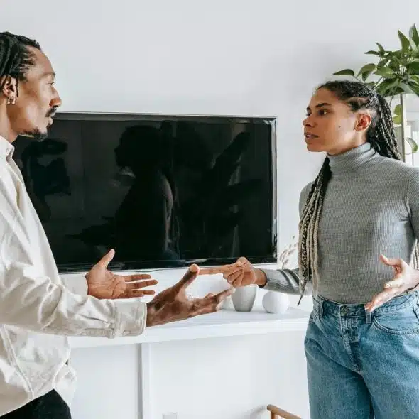 A couple having a serious talk at home