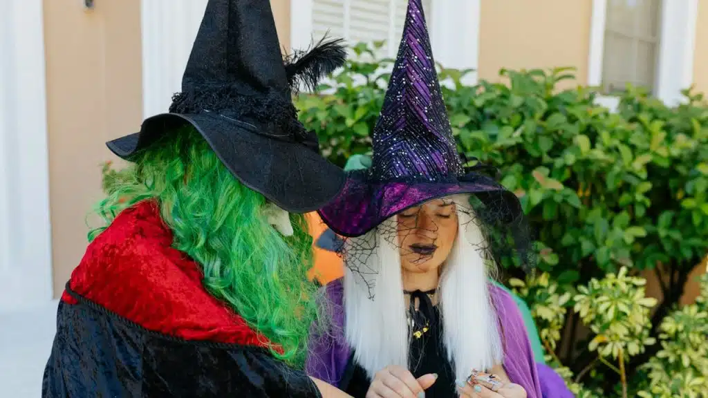 A couple dressed as a witch and warlock.