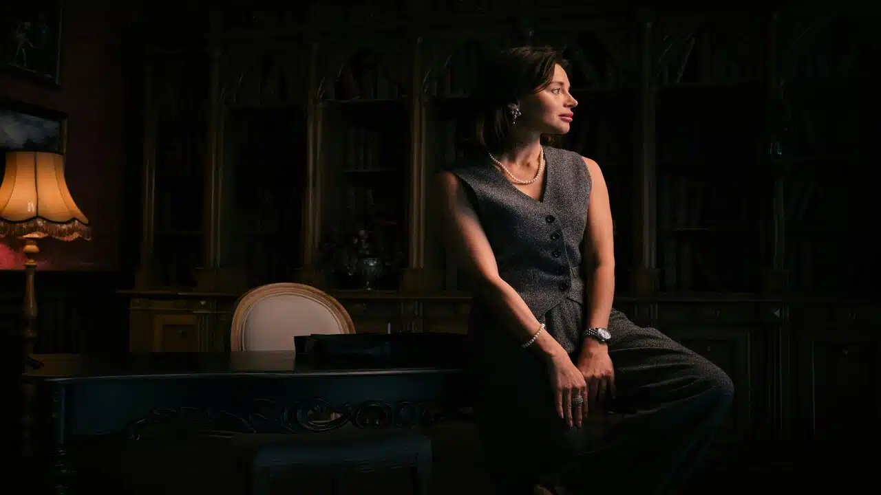 A woman wearing a pearl necklace.