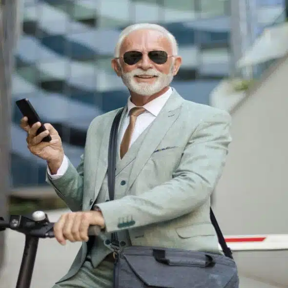 A handsome older man smiling at the camera