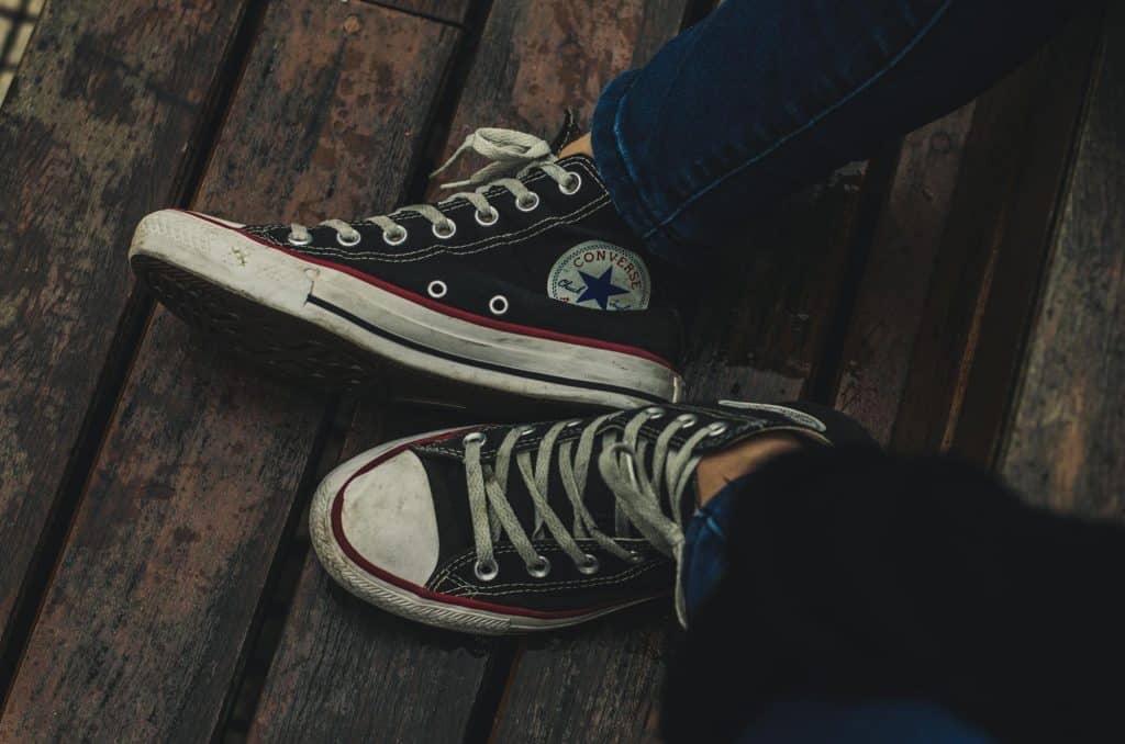 The person is wearing sneakers.