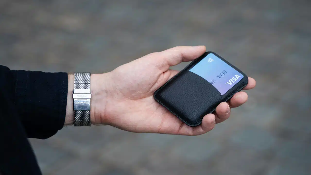 A man carrying a slim card holder.