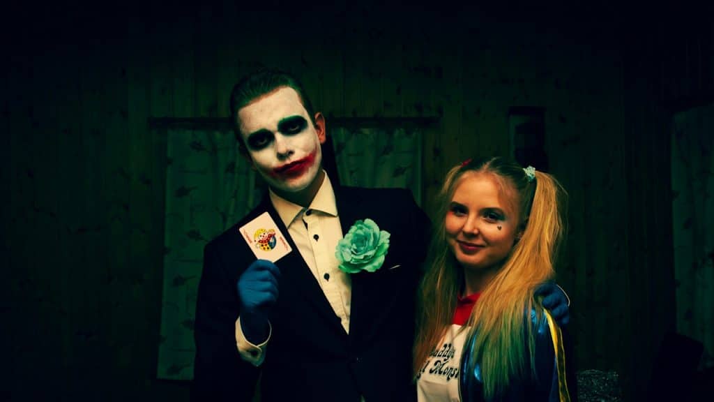 A couple dressed as Joker and Harley Quinn.