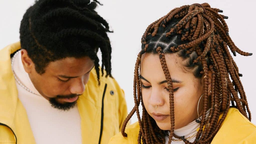 A man and a woman standing next to each other.