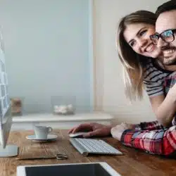 A couple looking at something on the computer