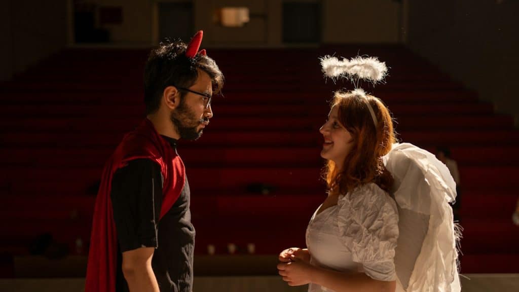 A couple dressed as an Angel and A Devil.