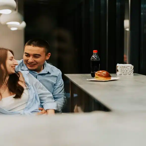 A couple spending time together at a cafe.