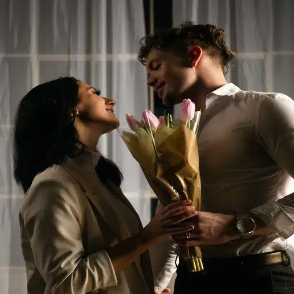 A couple saying goodbye at night