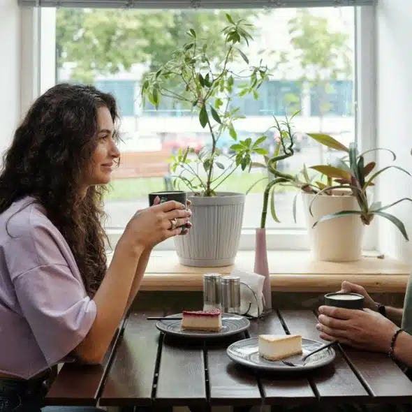 A woman and a man sharing coffee