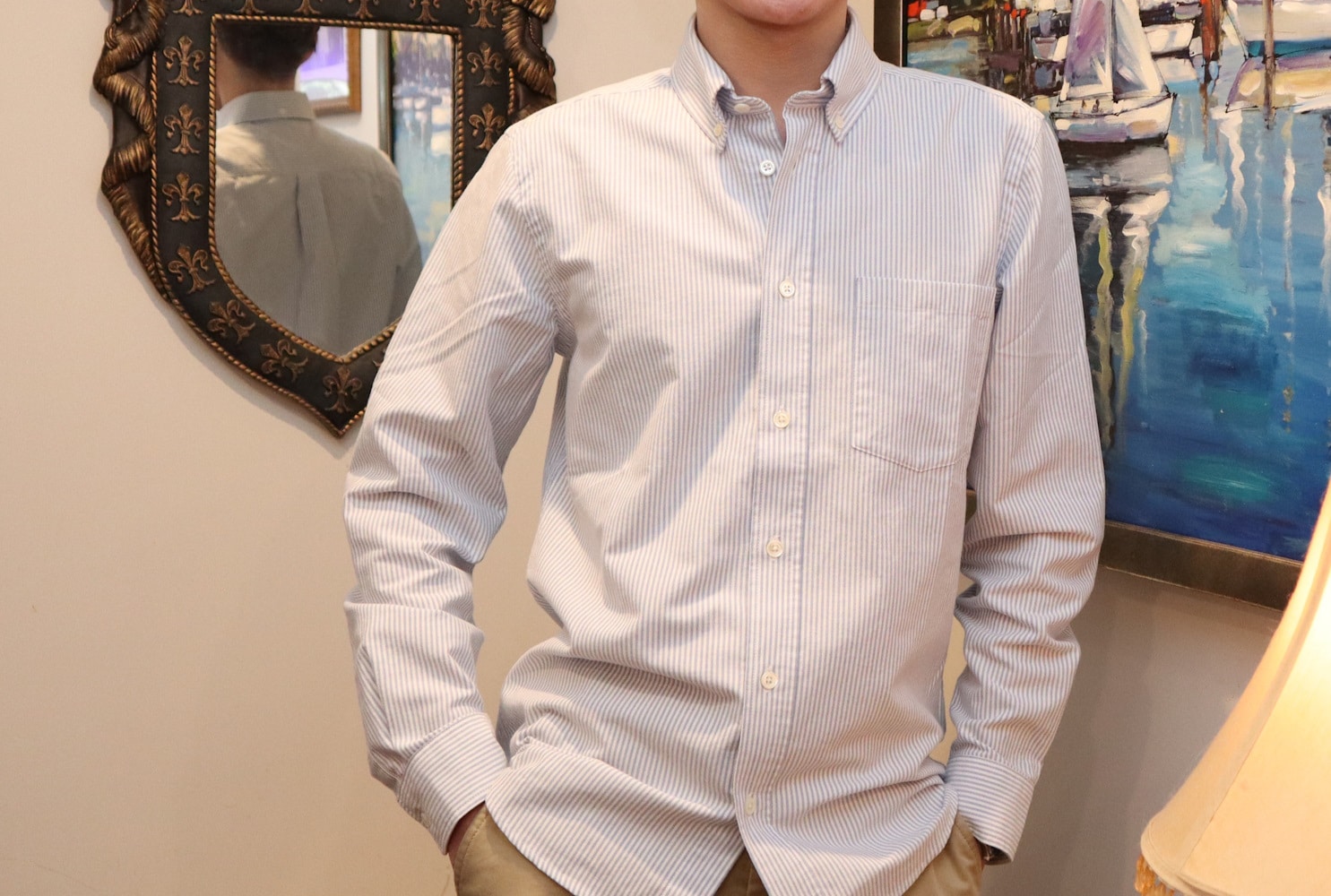 Karlton Miko Tyack Wearing The Asket Oxford Shirt with his hands in pockets