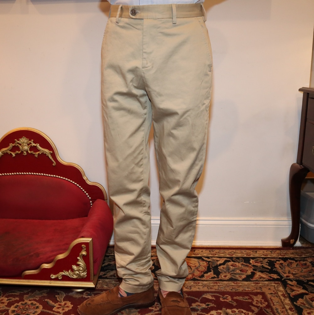 Karlton wearing The Asket Slim Chinos with brown shoes