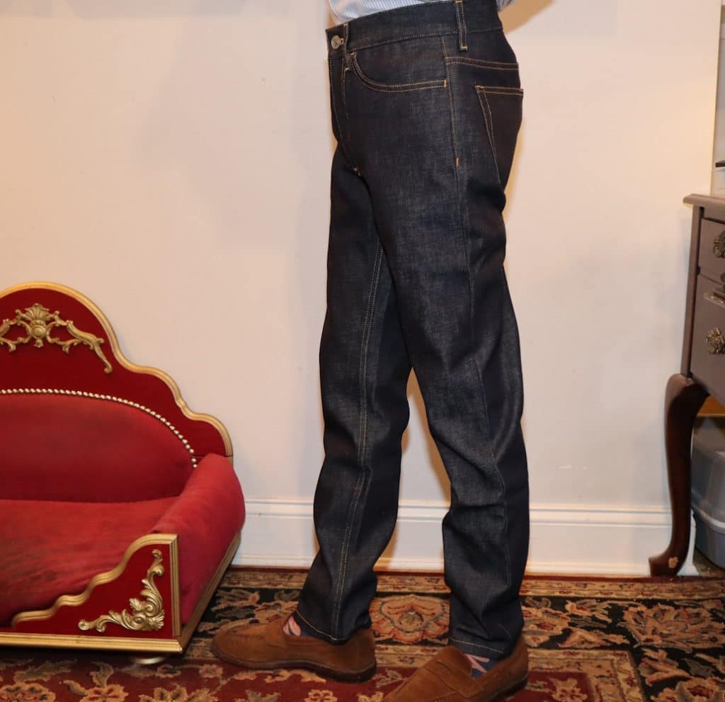 Karlton Miko Tyack wearing The Asket Slim Chinos with brown shoes